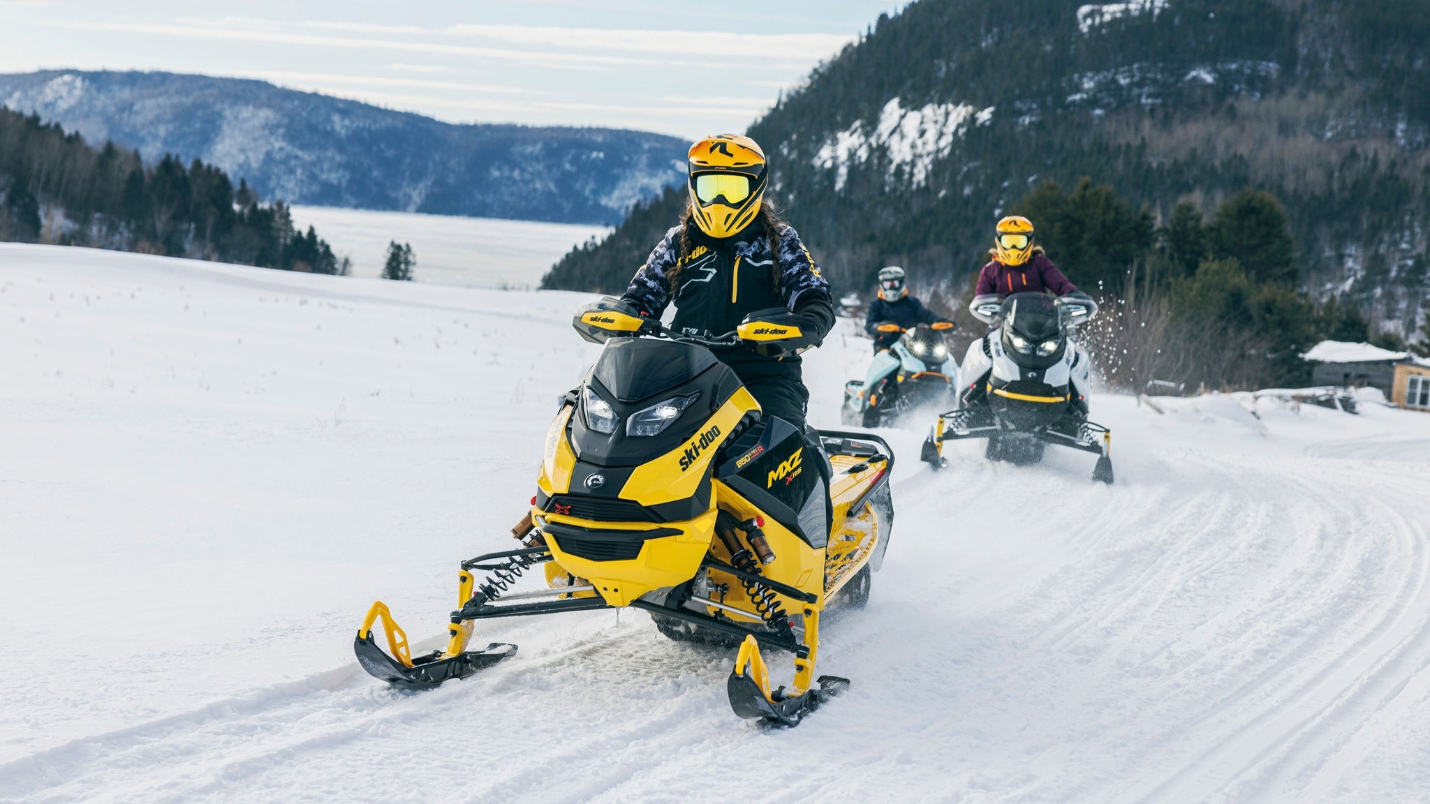 Ski-Doo riders in trail