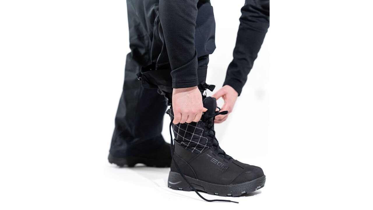 Ski-Doo model wearing boots