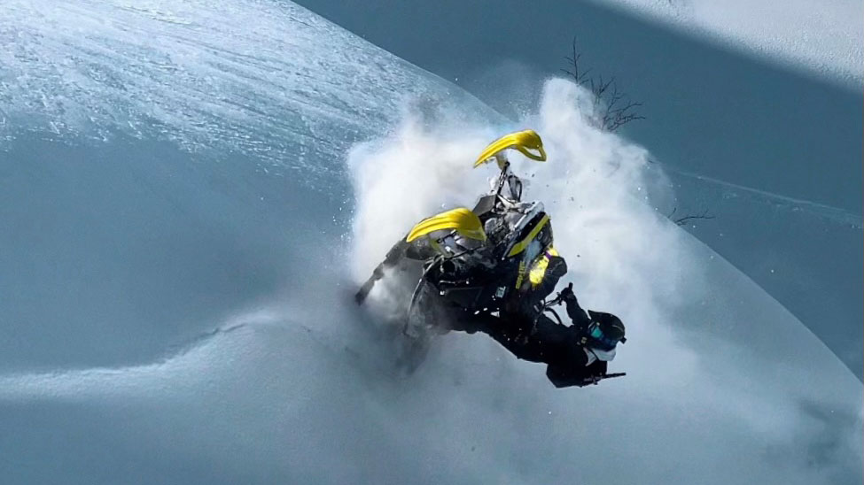 Ramona Johansen riding a Si-Doo in deep snow
