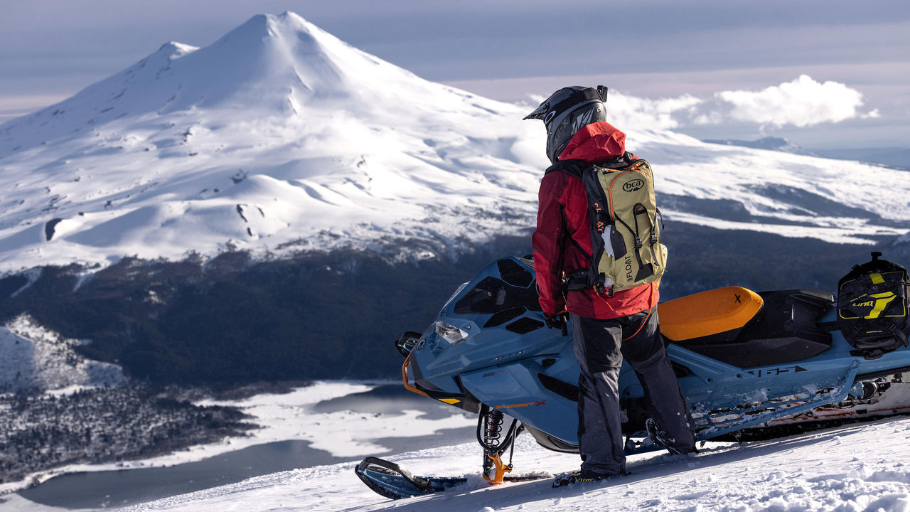 Man riding a Ski-Doo on top of a mountain in Chile