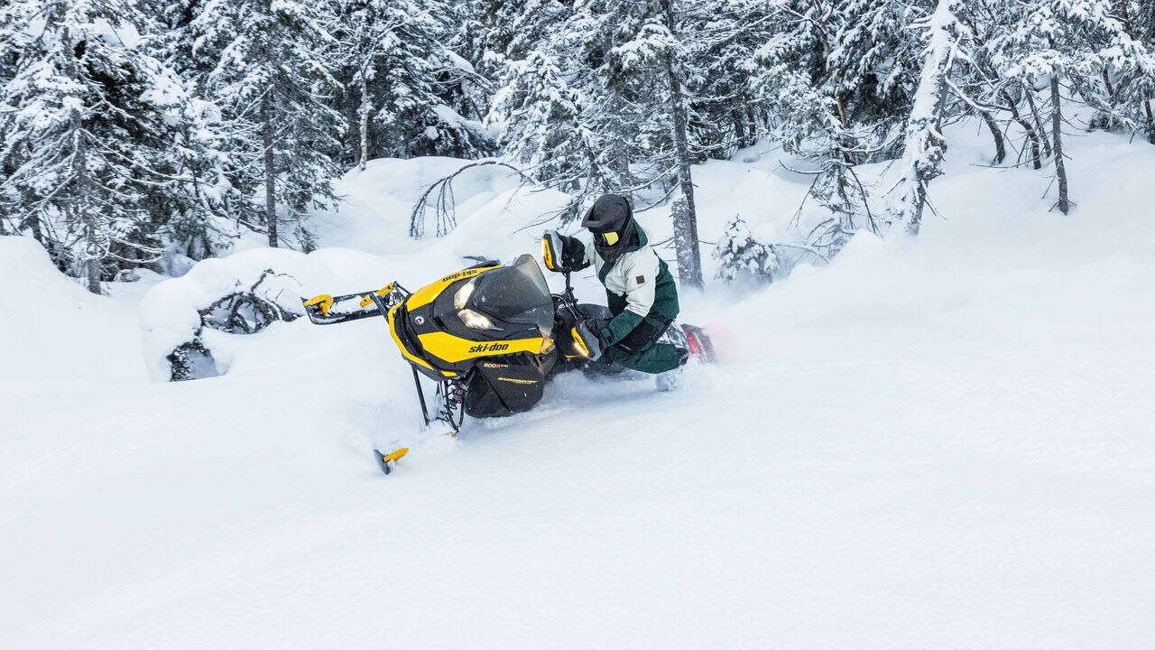 Woman riding the Backcountry Adrenaline in deep snow