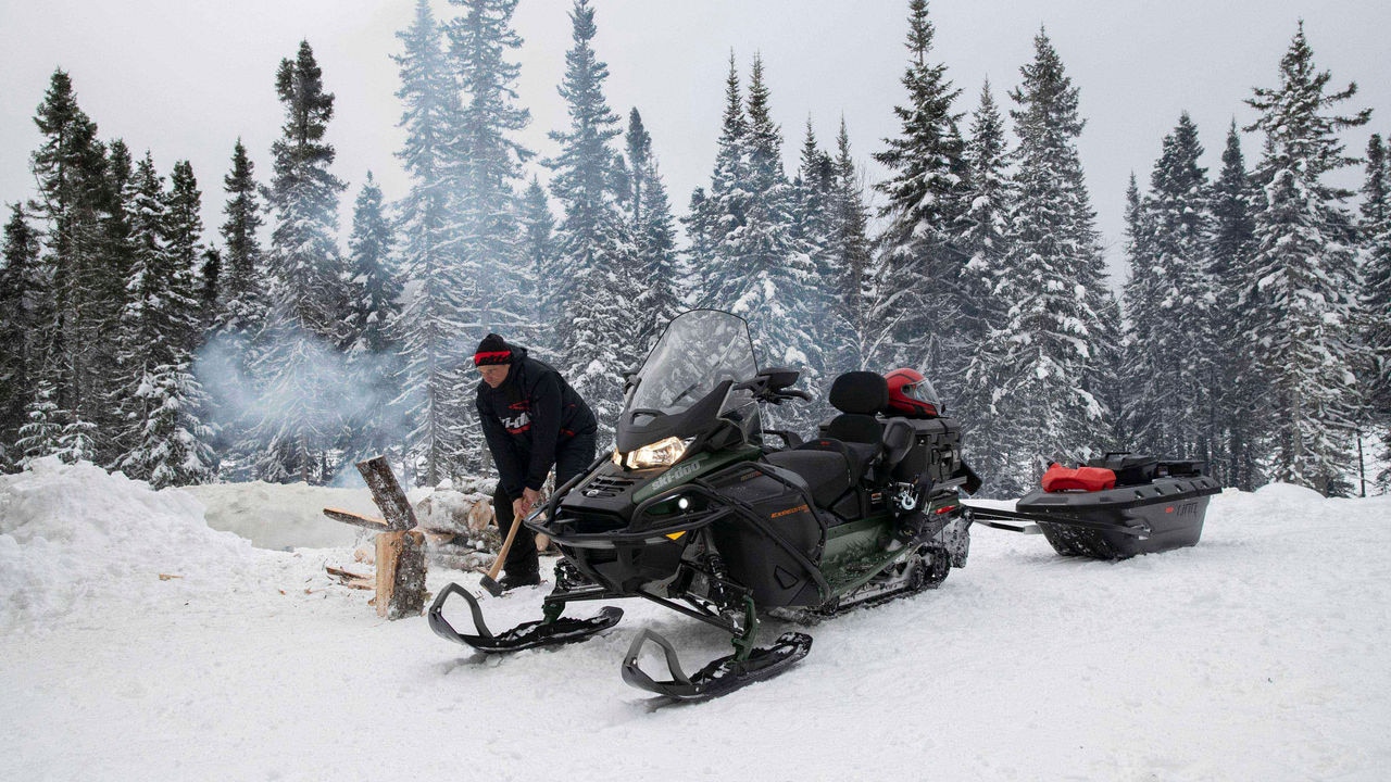 Man working next to his Ski-Doo Expedition