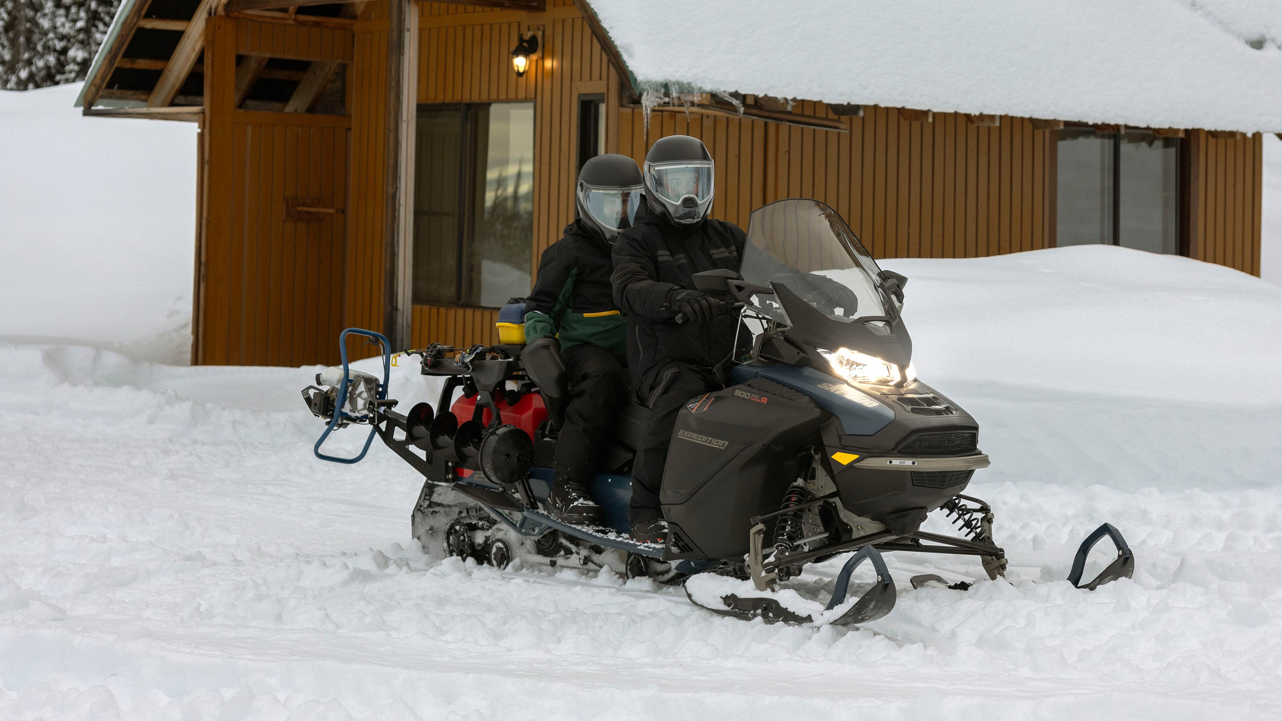 Two riders about to head off on a 2025 Ski-Doo Expedition crossover snowmobile