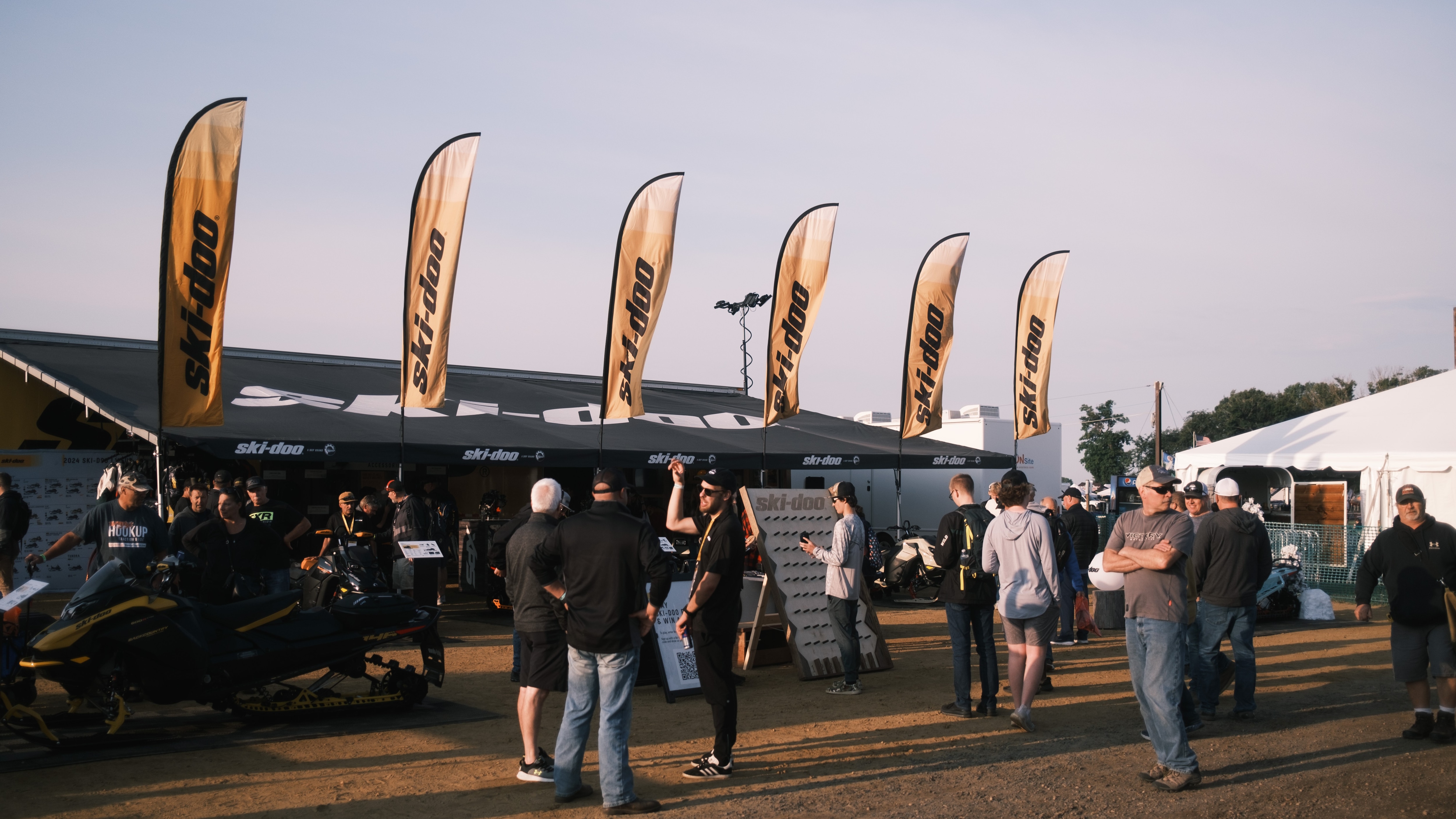 Ski-Doo snowmobile enthusiasts waiting in line for the Hay Days yearly event