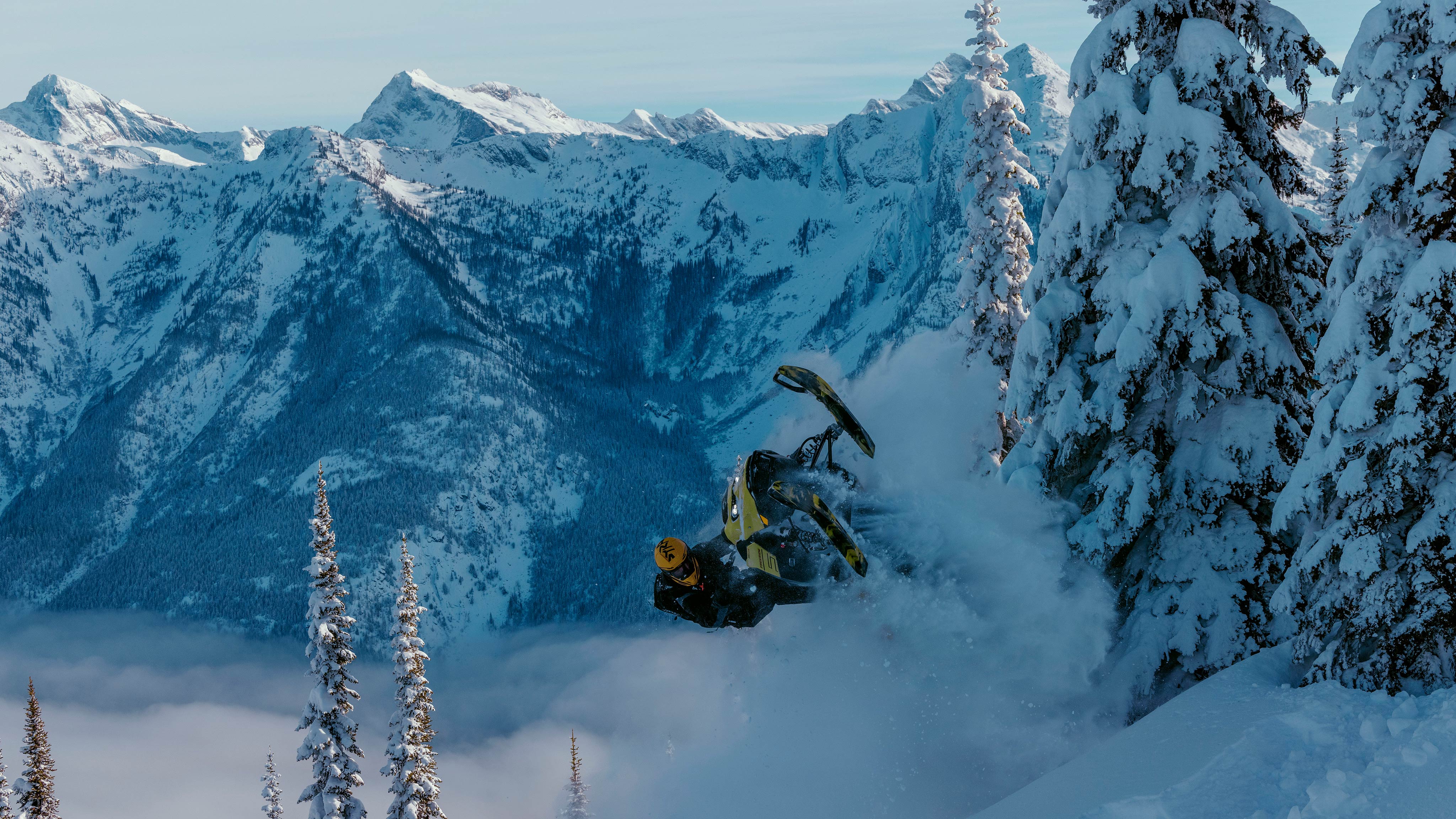 Rider pulling off a jump with a 2025 Ski-Doo Freeride deep snow snowmobile