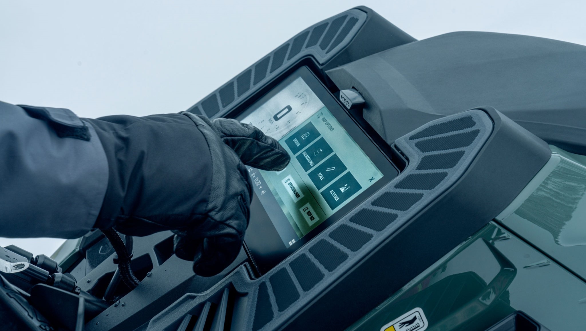 Close-up of the 10.25-inch touchscreen display on the 2026 Ski-Doo Summit snowmobile.