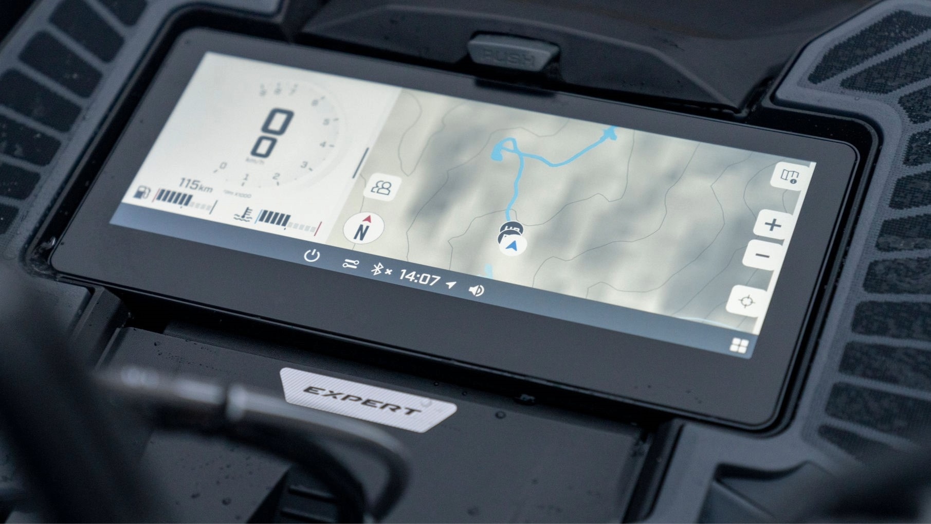 Close-up of the integrated GPS touchscreen display on a 2026 Ski-Doo Summit snowmobile.