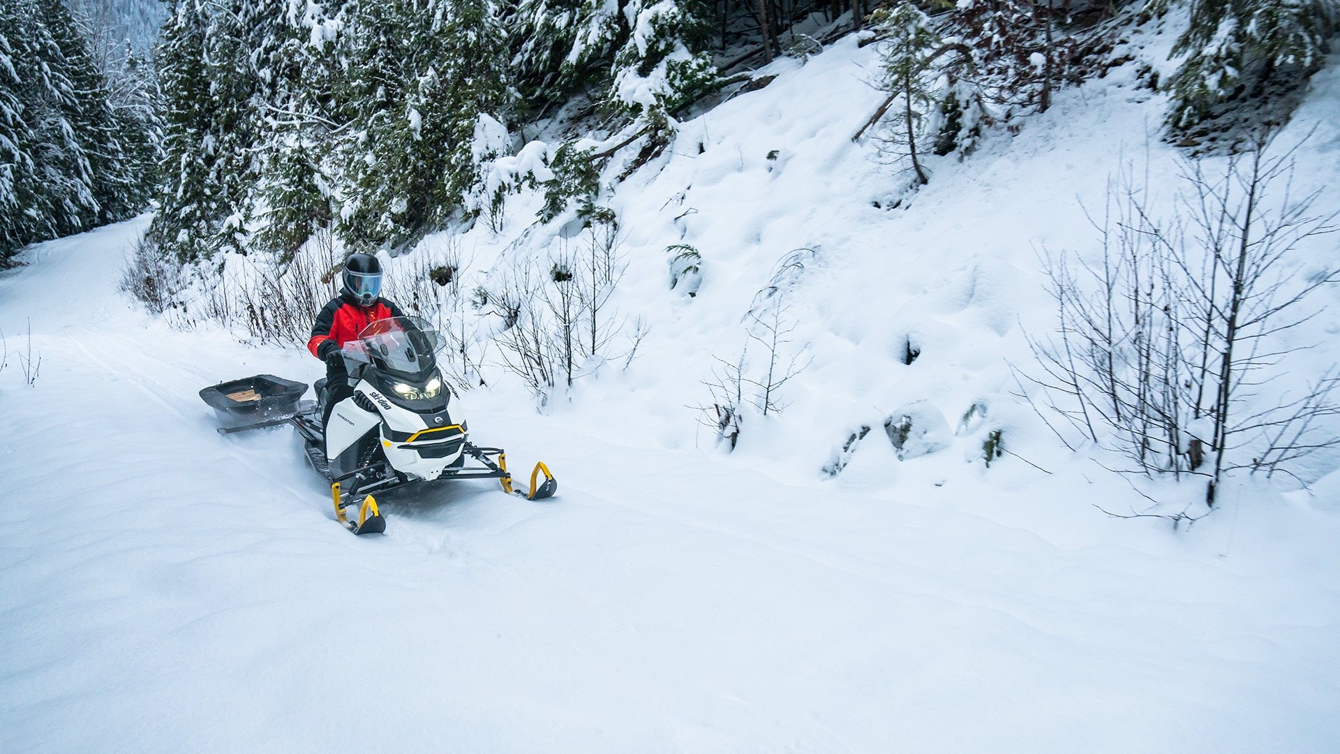 2026 Ski-Doo Expedition electric snowmobile pulling a sled