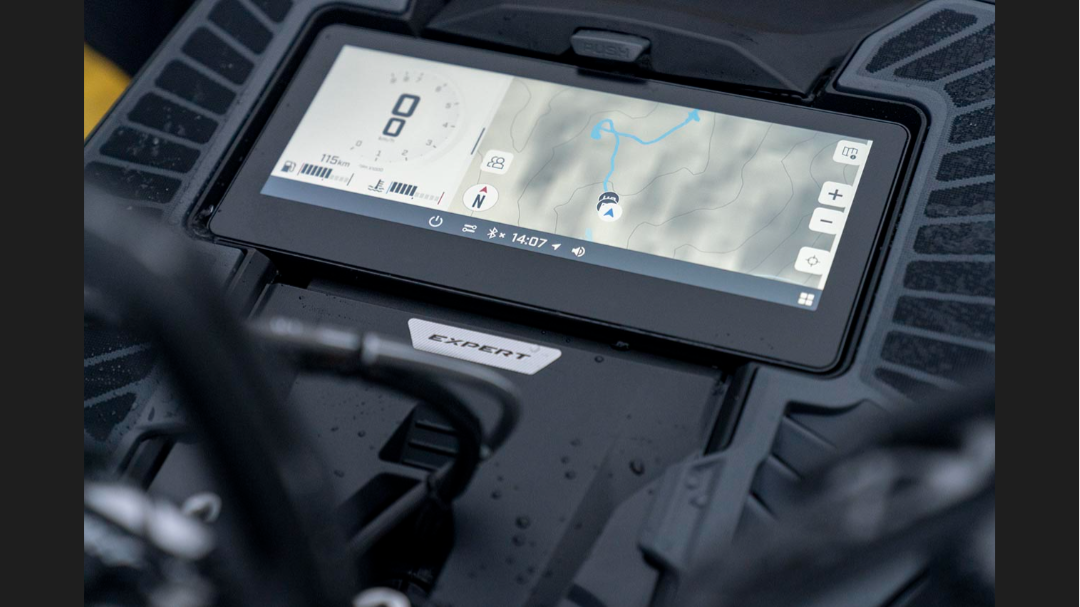 Close-up of the integrated GPS touchscreen display on a 2026 Ski-Doo Summit snowmobile.