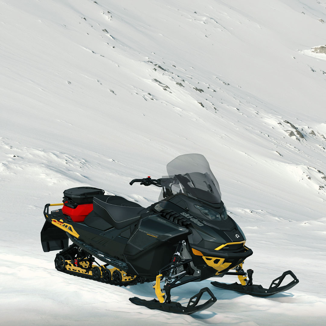 Ski-Doo Renegade parked at the base of a mountain