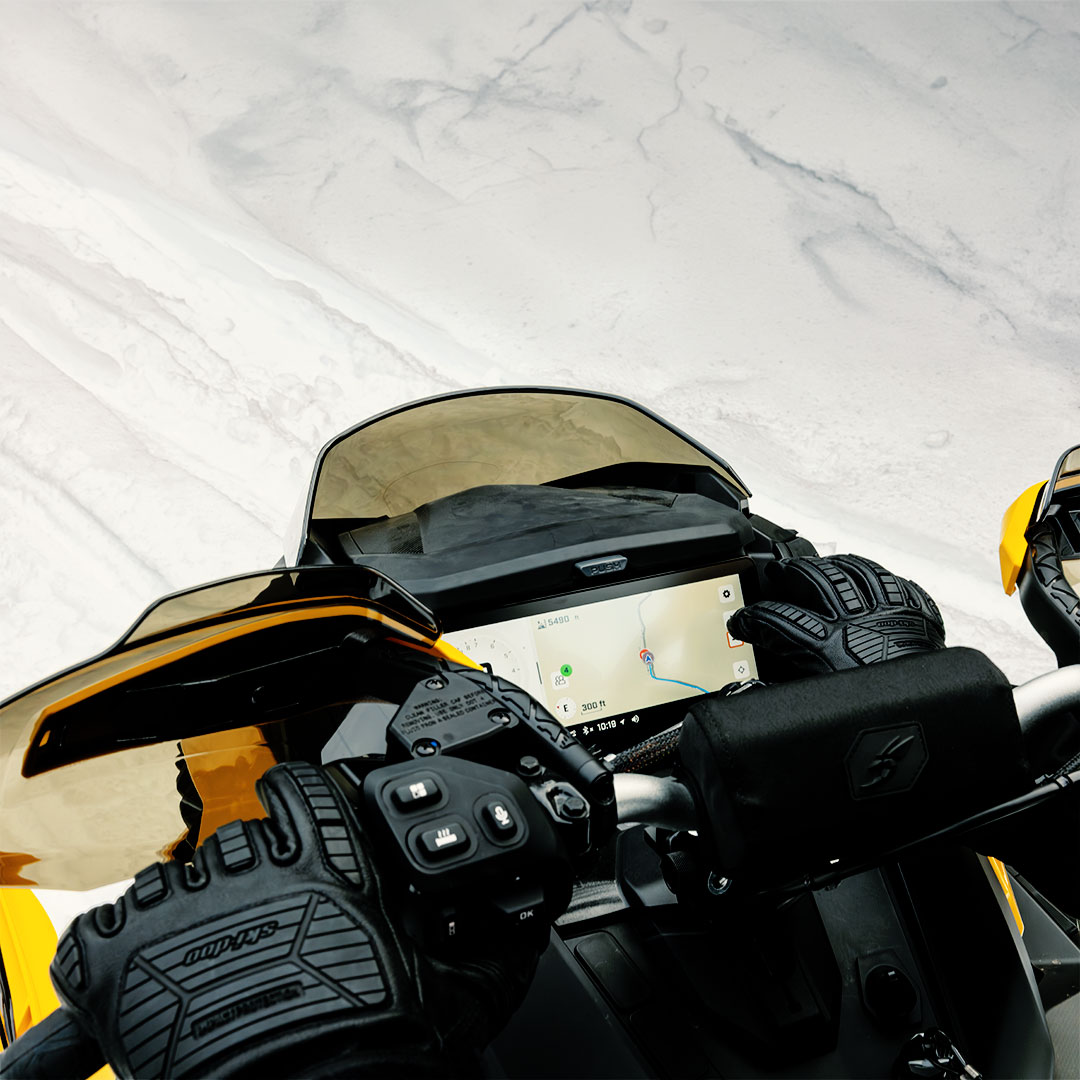 Snowmobiler using the touchscreen display of this Ski-Doo