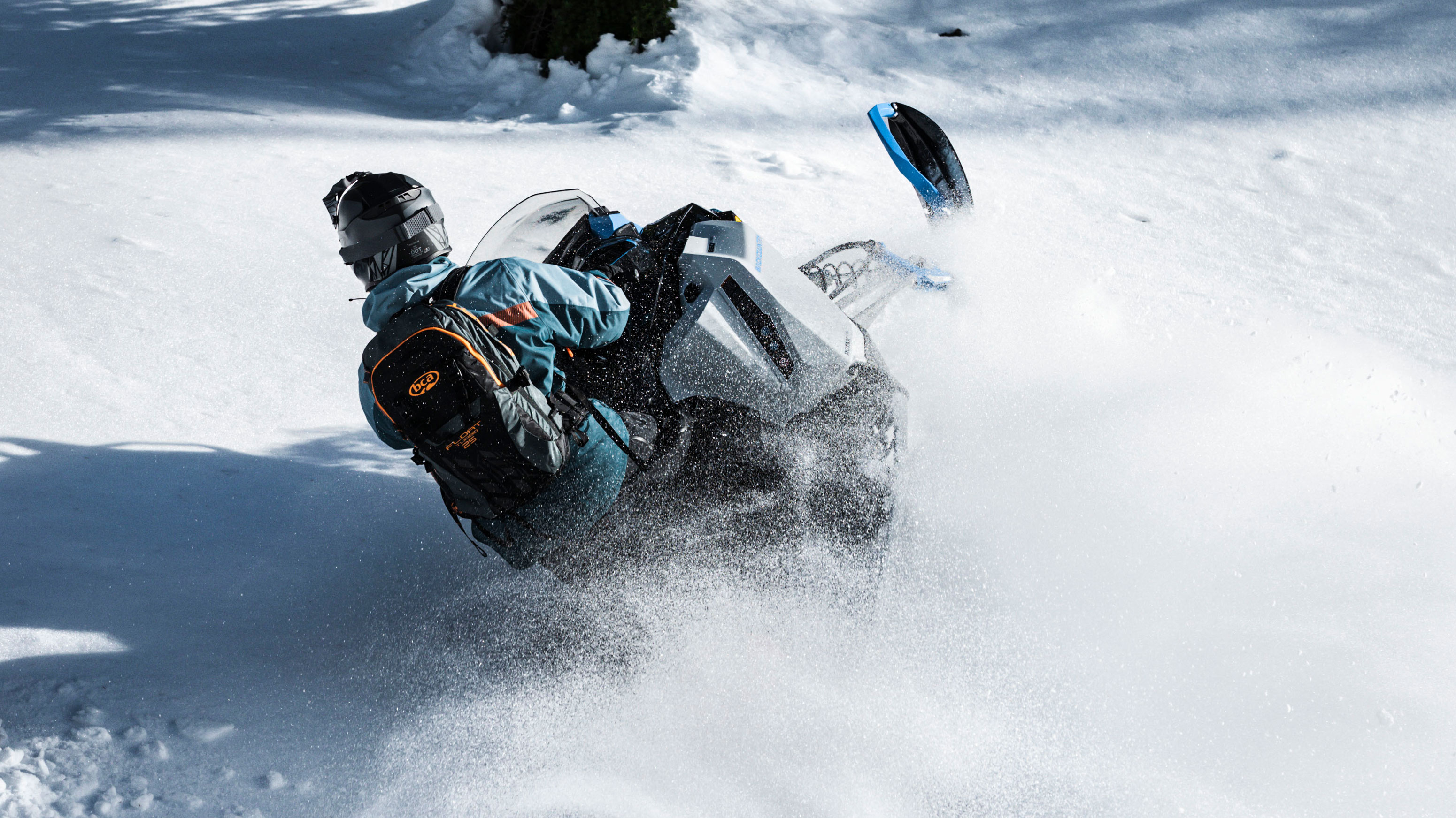 Man driving a Ski-Doo Backcountry in deep snow
