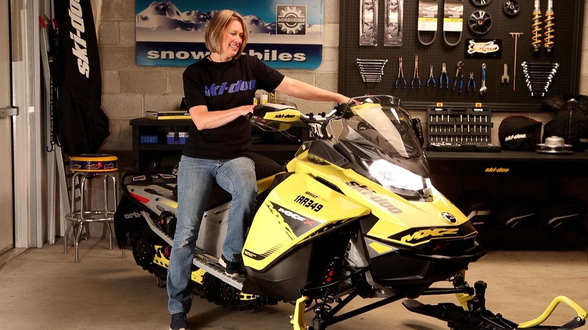 MJ Thompson prepping her trail snowmobile for the new season