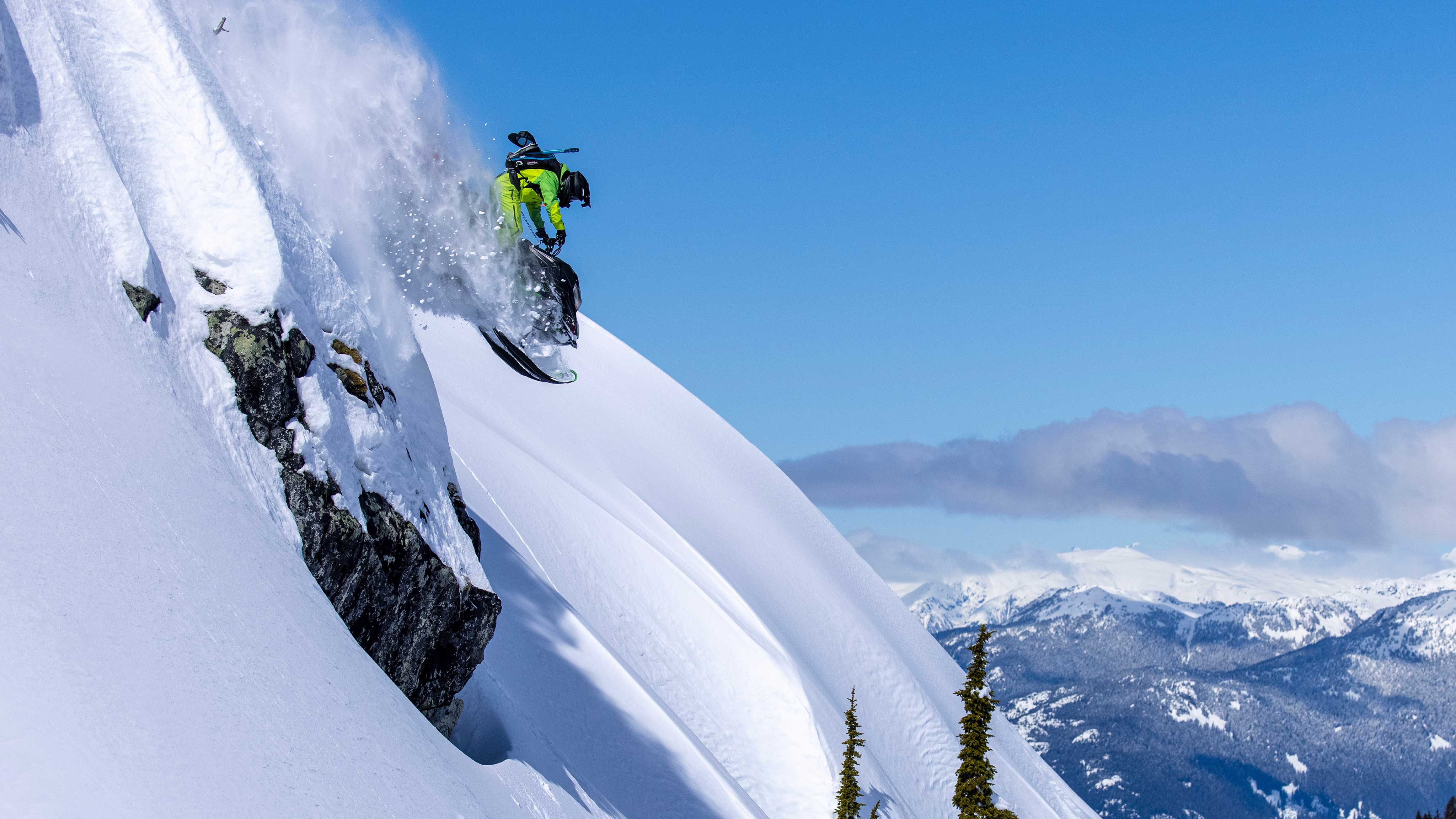 Ski-Doo Ambassador Cody McNolty jumping a cliff with his Ski-Doo snowmobile