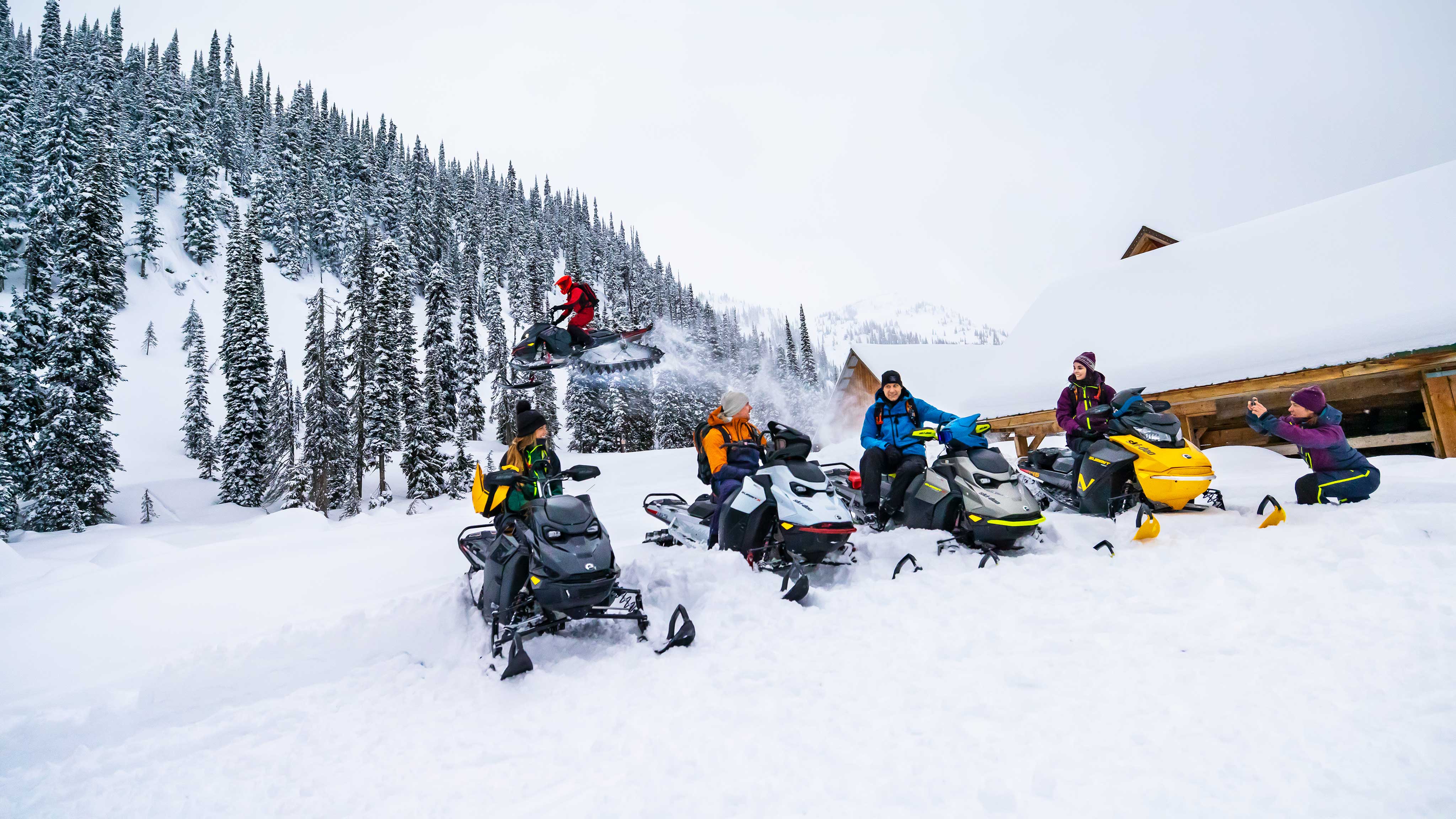 Group of friends enjoying a day with their Ski-Doo snowmobiles
