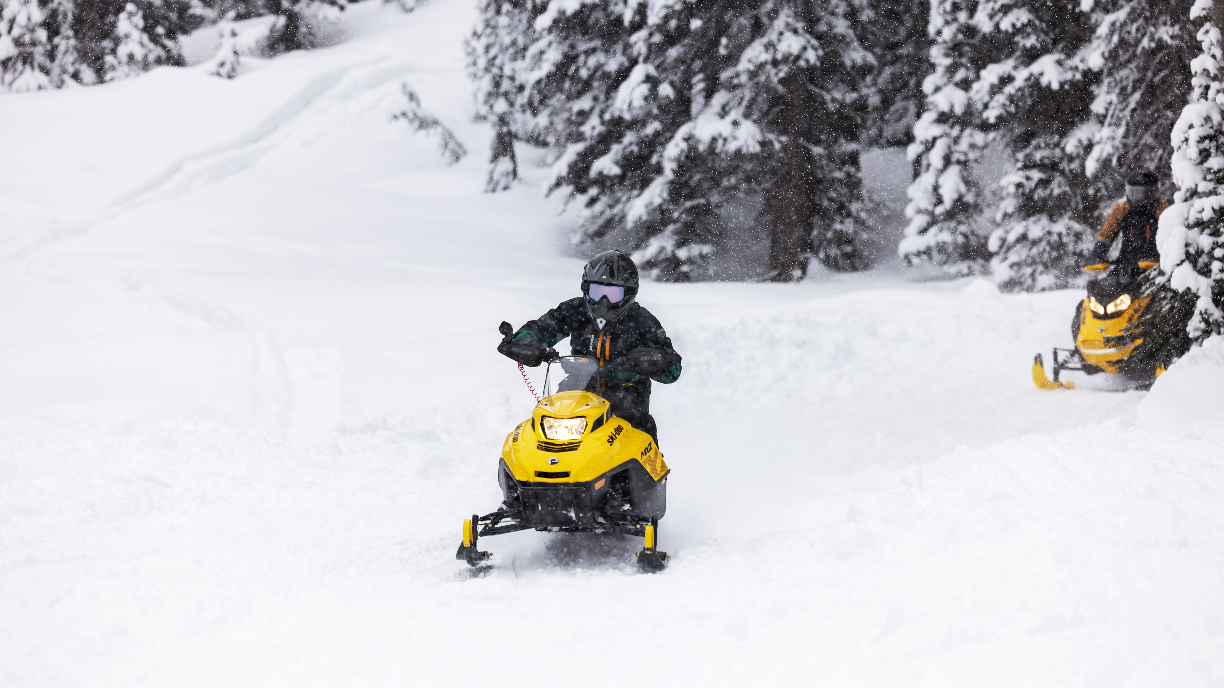 Young rider on a the youth snowmobile Ski-Doo MXZ