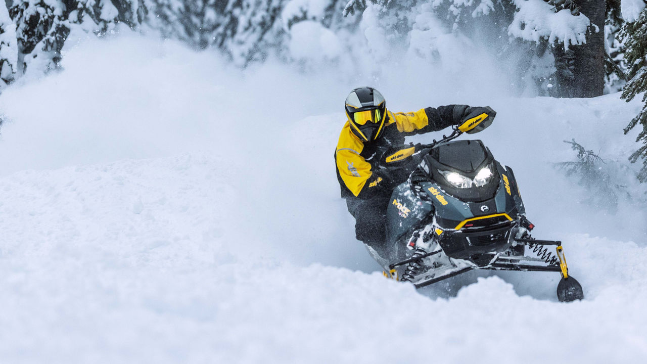 2026 Ski-Doo MXZ X-RS snowmobile cornering on snowy trail