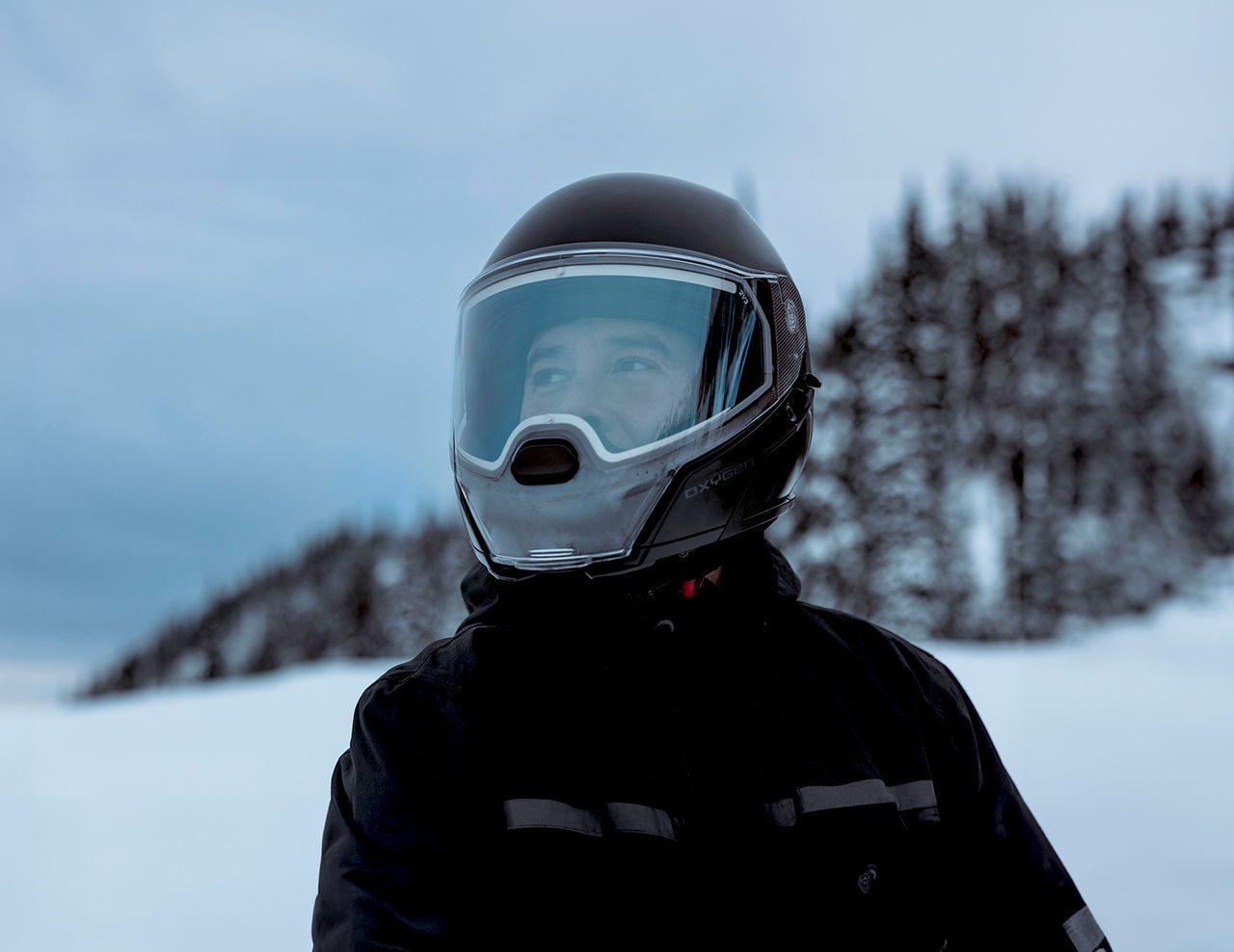 Rider wearing a Ski-Doo helmet